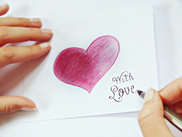 Write to someone special, writing a note card with love