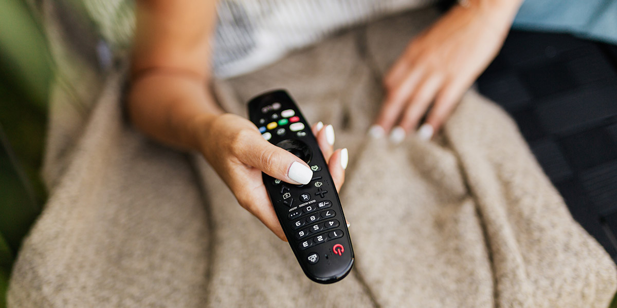 Woman holding a remote control; don't press pause on your health