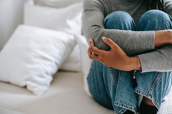 Anxious woman sitting down and using her designated worry time to think through problems