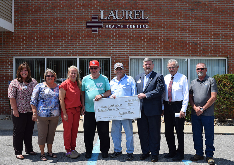 Members of Blossburg Lodge #350 present a $250 check Blossburg Laurel Health Center staff and Laurel Health leadership