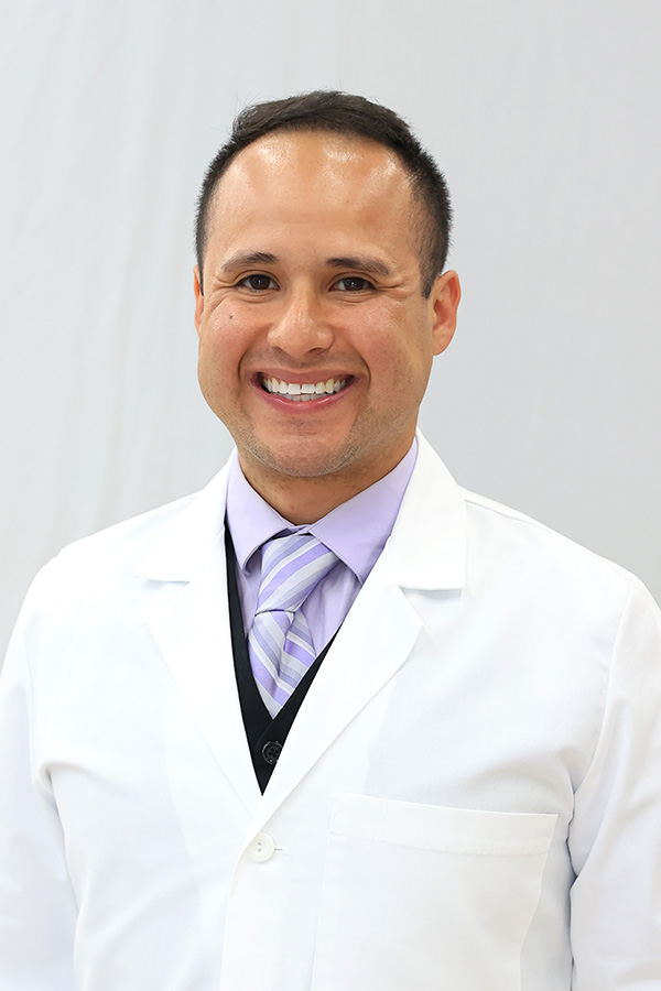Photo of Dentist Dr. Adam J Hainley, DMD in a white coat, who now provides dental care at Laurel Dental - Troy, located within the Troy Laurel Health Center at 45 Mud Creek Rd. in Troy, PA