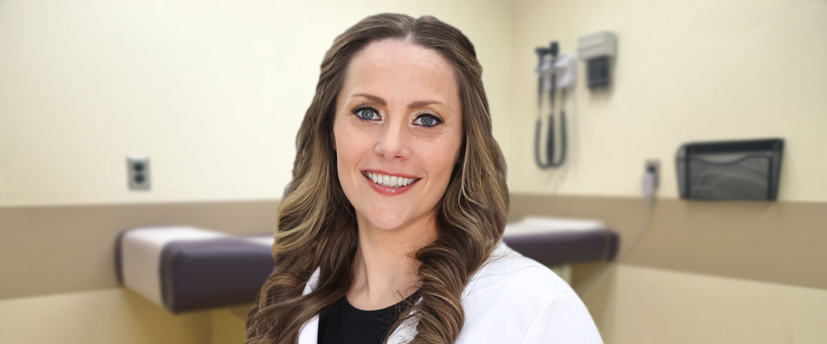 Photo of Beth Geiger, FNP-C, in an exam room; Beth is a certified registered family nurse practitioner practicing at the Towanda Laurel Health Center in Bradford County, PA