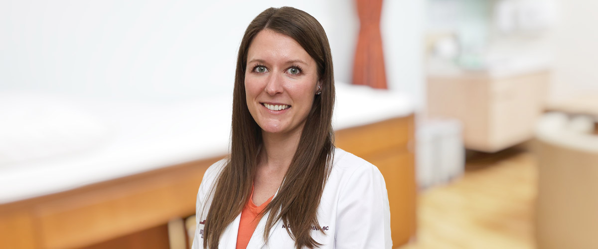 Nicole Doan, Women's Health Provider, standing in an exam room;Nicole is a certified women’s health nurse practitioner at Mansfield and Wellsboro Laurel Health Centers