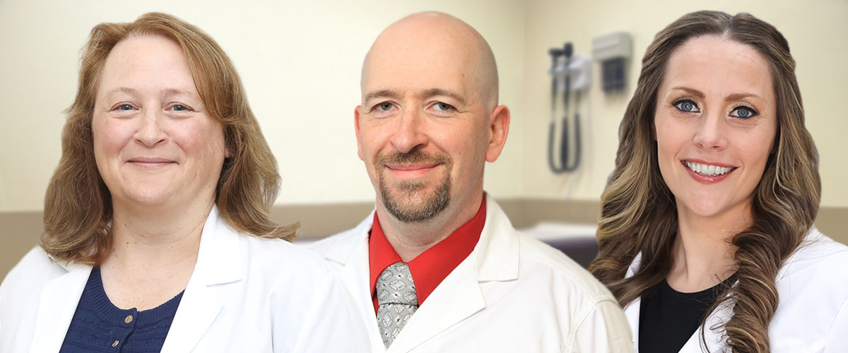 Towanda Laurel Health Center providers Shannon Nobles, PMHNP-BC, Daniel Branzburg, CRNP, and Beth Geiger, FNP-C, DNP standing in a medical exam room