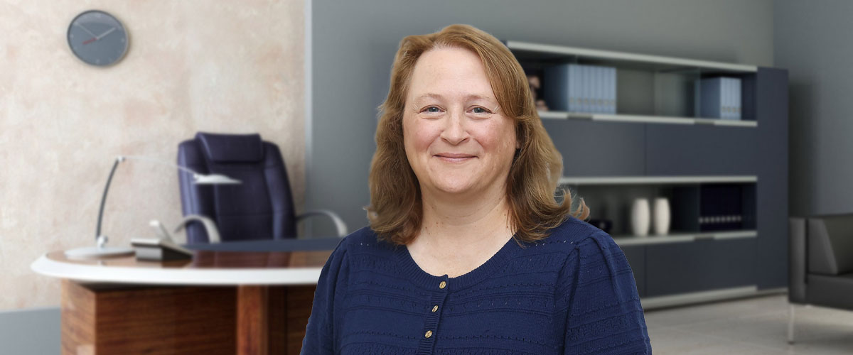 Photo of Shannon Nobles, PMHNP-BC, standing in an office. Shannon is psychiatric mental health nurse practitioner who now provides mental and behavioral health services at the Towanda Laurel Health Center, located at 410 Main St. in Towanda, PA.