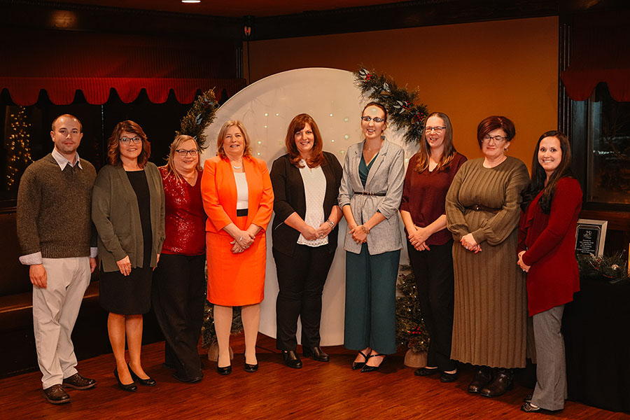 A group of milestone honorees with Laurel Health leadership being recognized for their years of service and dedication at a special recognition dinner.